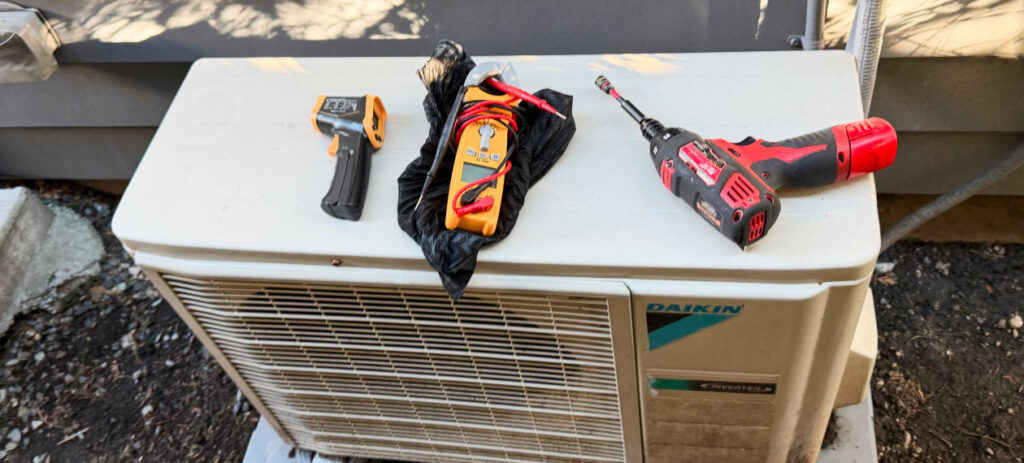 HVAC technician performing AC repair service at a Seattle home.